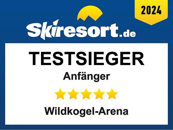 Auszeichnung von Skiresort.de, Testsieger 2024 für Anfänger mit 5 Sternen, an die Wildkogel-Arena vergeben. Gelbes Logo in der oberen Ecke.